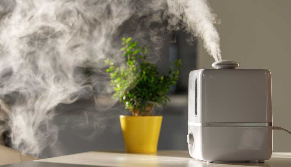 humidifier on table with steam coming out 