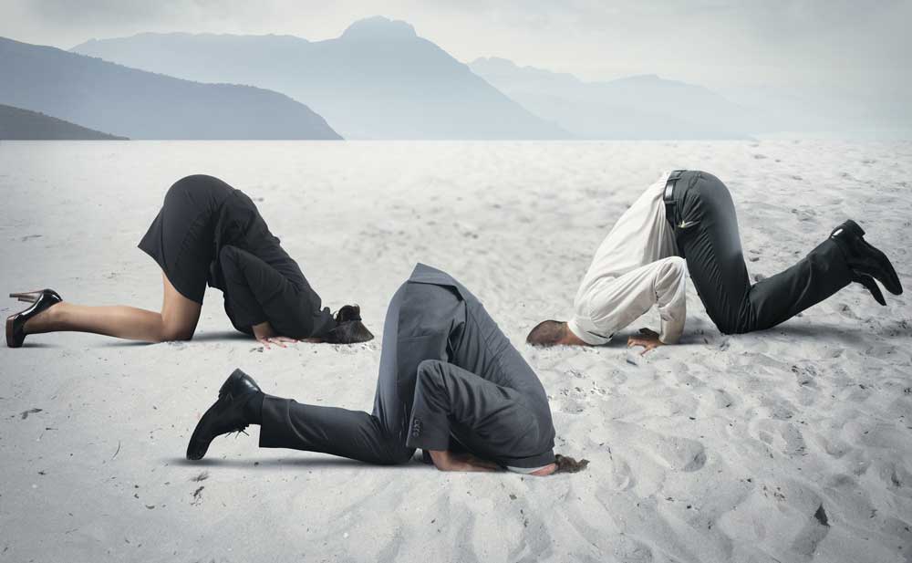 people with their heads in the sand